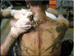 Todd Tattoo Artist doing the outlines